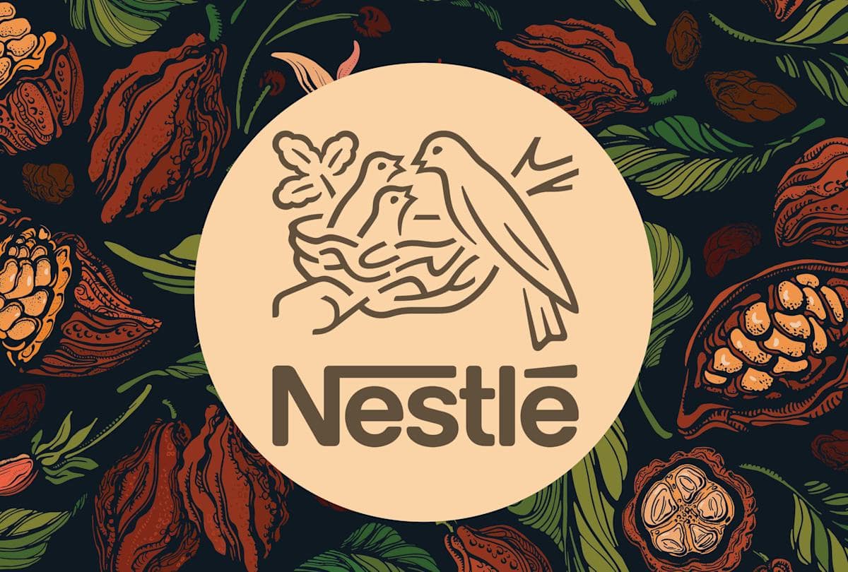 Nestle logo, cocoa fruit background, source: Food & Wine / Nestlé / Getty Images