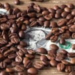 Coffee beans on dollar, source: Shutterstock