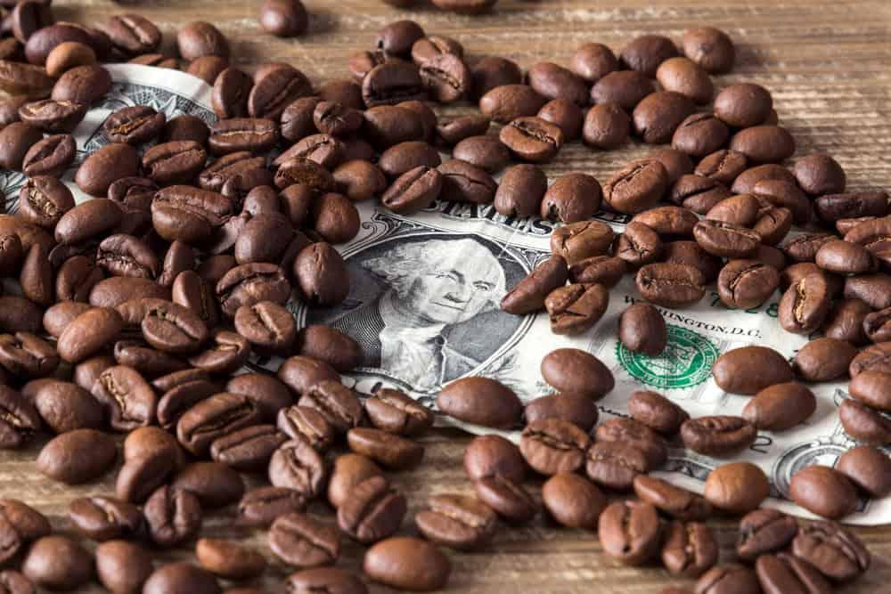 Coffee beans on dollar, source: Shutterstock